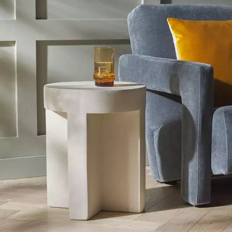 Round Accent Table – White Sculptural Cross Base, Modern Indoor Design