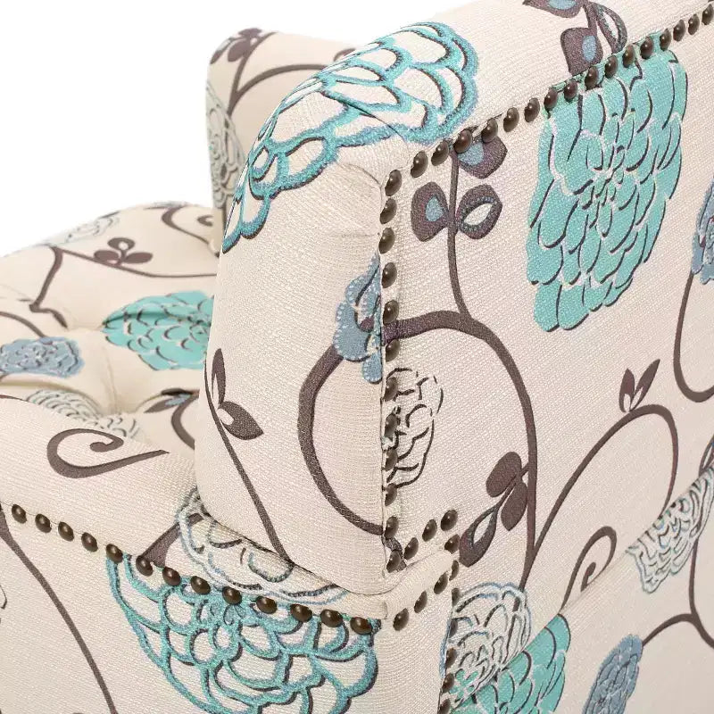 Poltrona club tufted Harrison – rivestimento floreale bianco/blu, struttura in legno massiccio