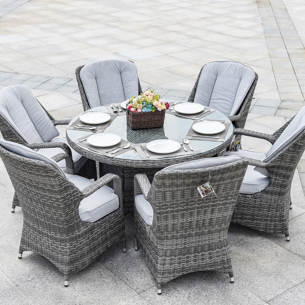 Set da pranzo rotondo da esterno in rattan intrecciato da 7 pezzi con cuscini di Moda Furnishings