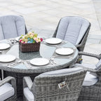 Set da pranzo rotondo da esterno in rattan intrecciato da 7 pezzi con cuscini di Moda Furnishings
