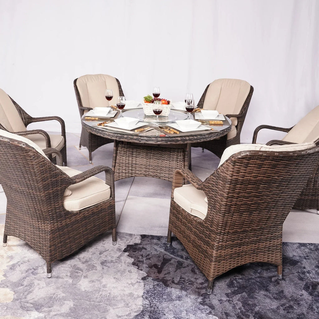 Set da pranzo rotondo da esterno in rattan intrecciato da 7 pezzi con cuscini di Moda Furnishings